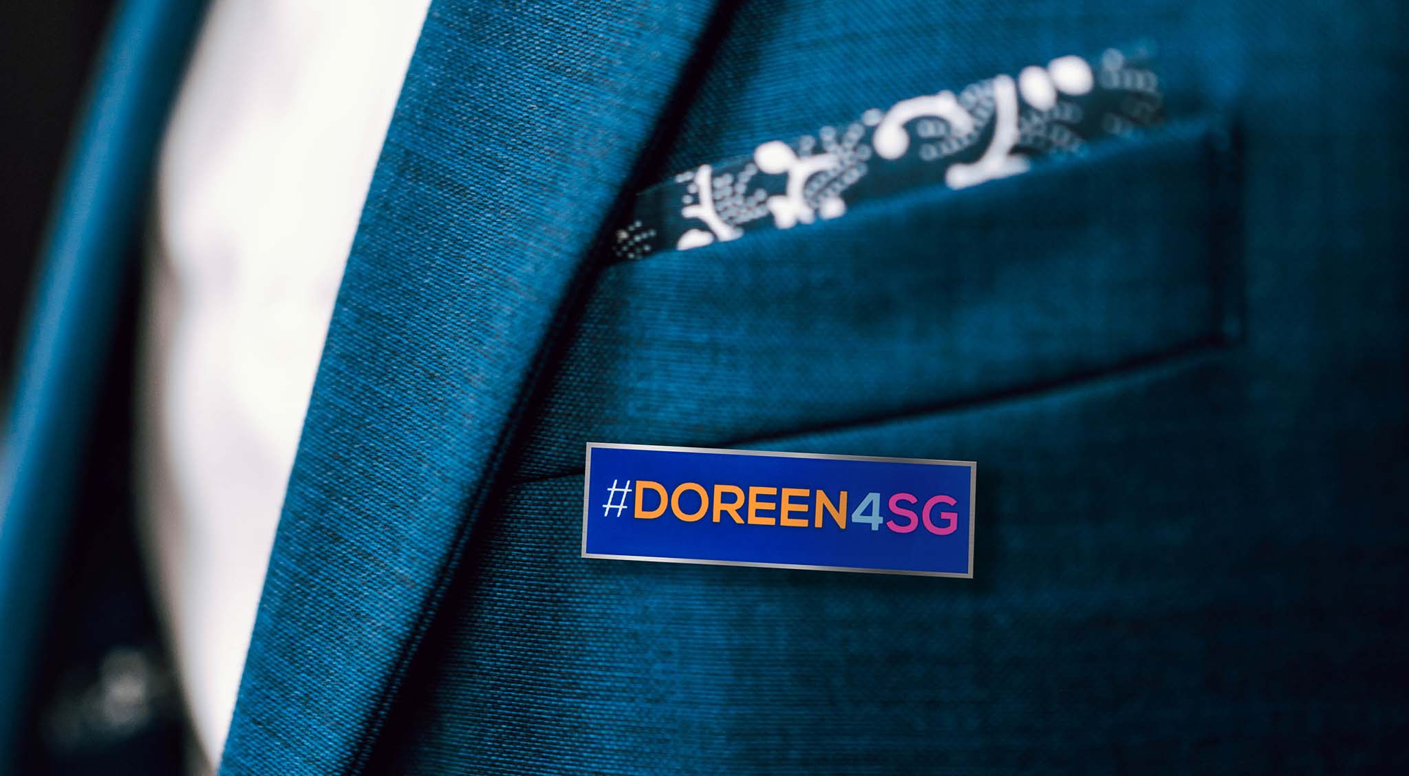 Image showing a lapel pin tag on a jacket as part of a digital and print marketing campaign run by SmartCuts Creative in Lausanne and Geneva, Switzerland for the US Mission to the United Nations