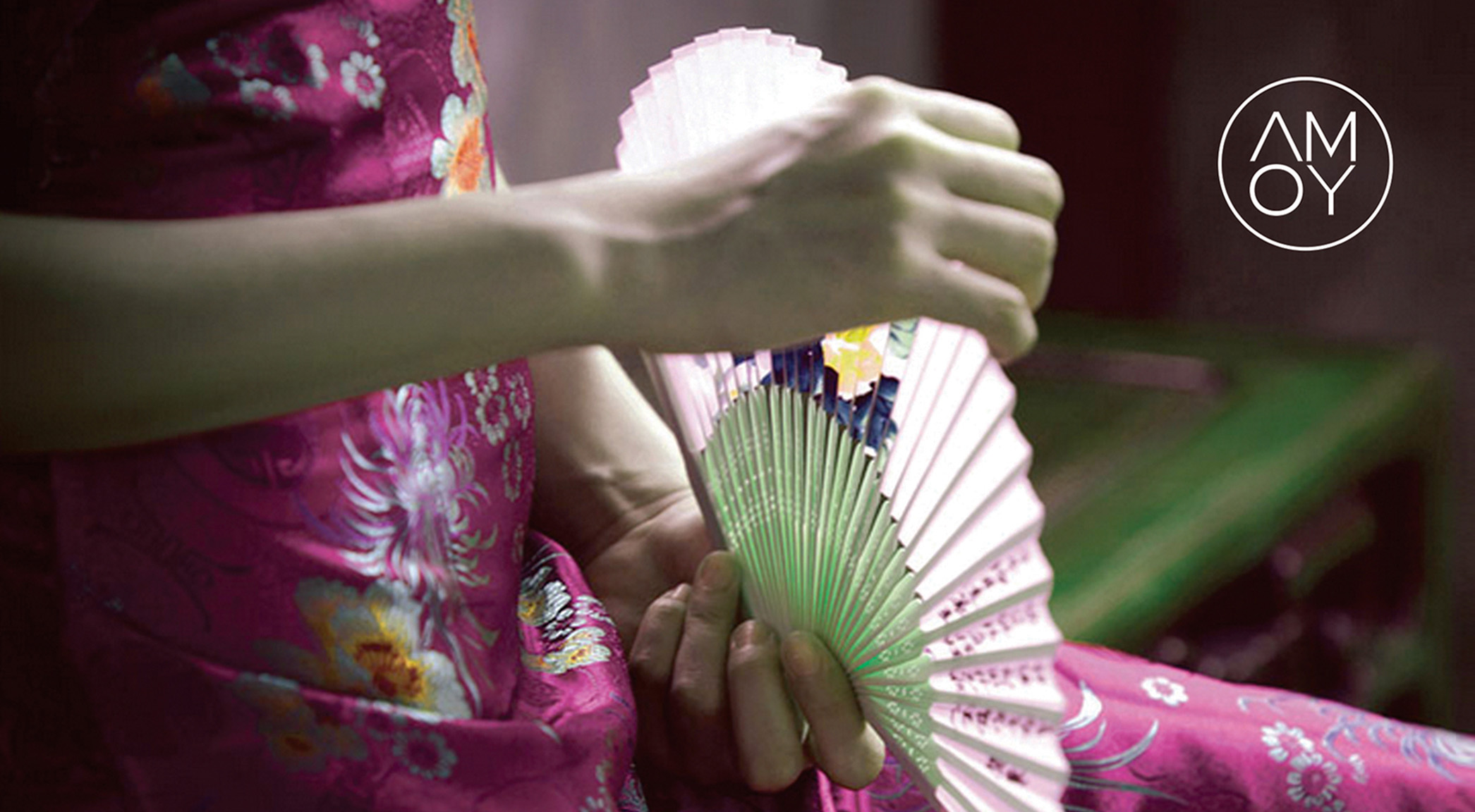 Image showing a woman's hands with a fan of Asian design, and a logo, as a sample of work done in visual identity, design and branding, by the SmartCuts Creative Agency studio in Lausanne and Geneva, Switzerland for the purposes of creative communication.