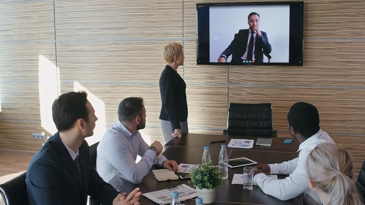 Image showing a team involved in video conferencing to illustrate the video conference consulting service offered by SmartCuts creative agency studio in Lausanne and Geneva, Switzerland for the purposes of creative communication.