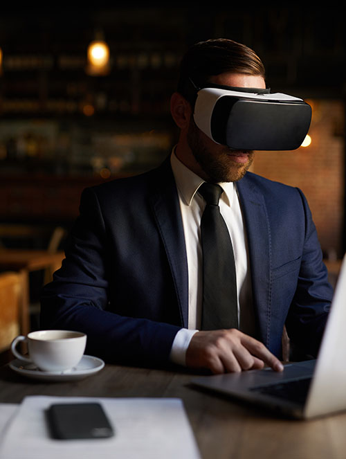 Image showing a businessman with virtual reality goggles to illustrate the virtual and augmented reality service offered by Fullframe creative agency studio in Lausanne and Geneva, Switzerland for the purposes of creative communication.